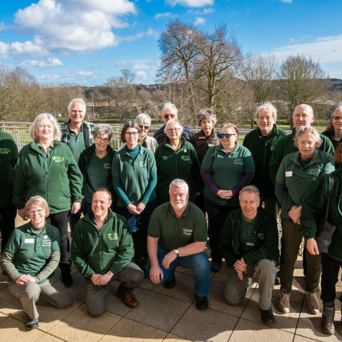 Master Composters stood smiling in Garden Organic Uniform
