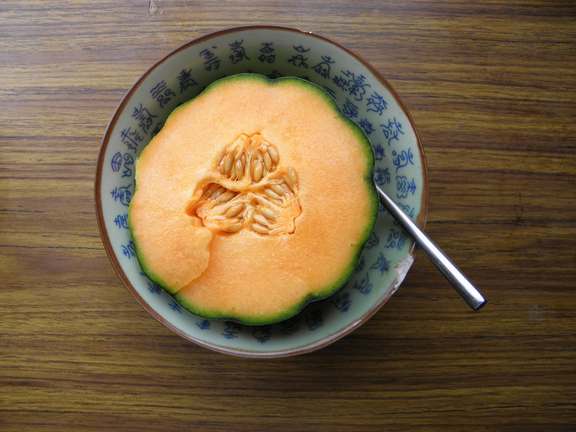 Melon sliced in half in bowl